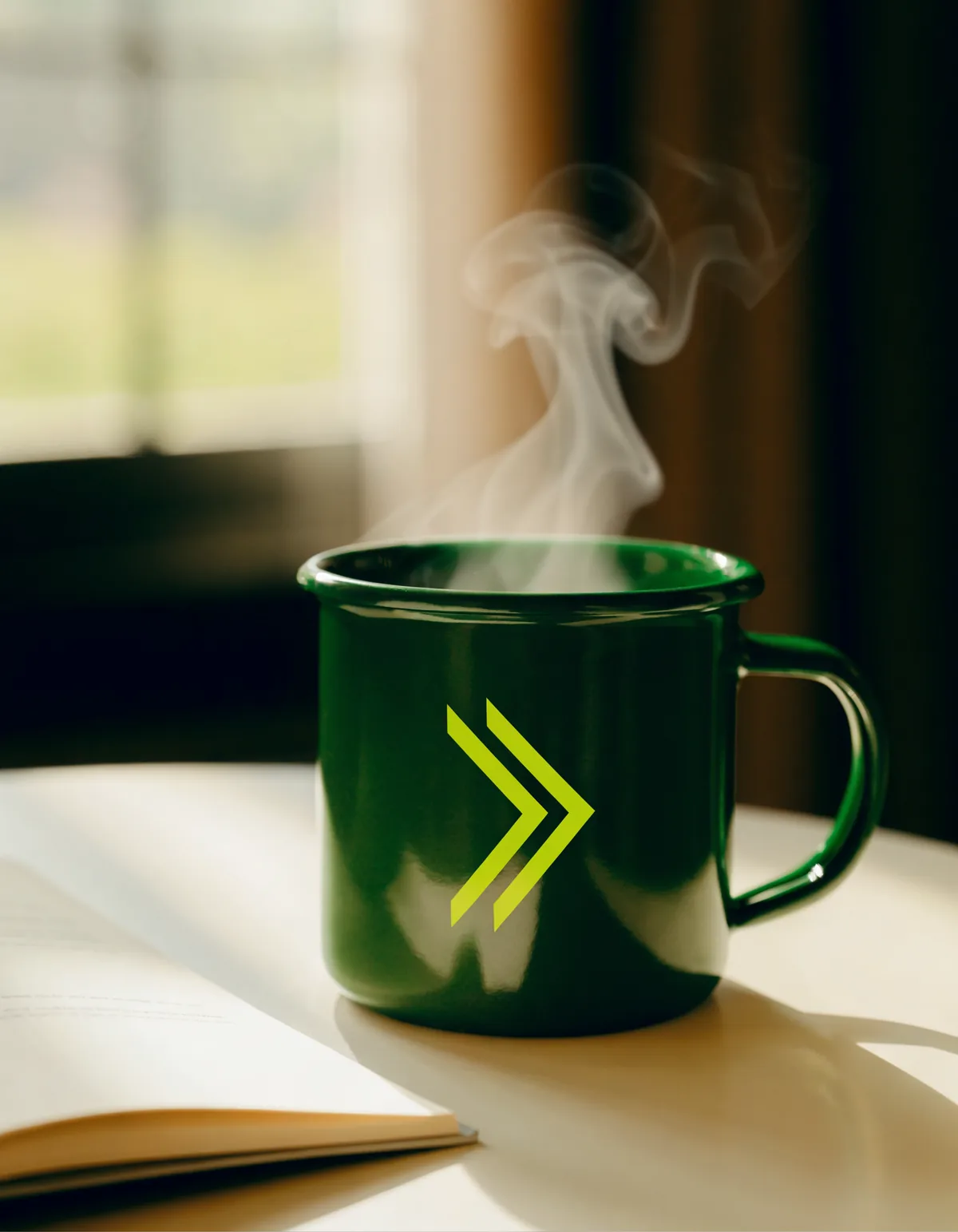 A deep green enamel mug carrying the volt chevron mark